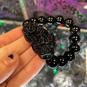 Black Beaded Bracelet with Carved Chinese Stone